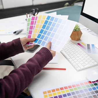 young-female-designer-choosing-right-colors-logo2.jpg