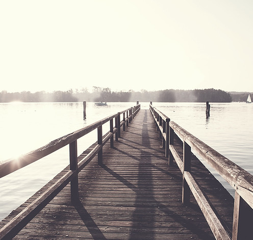 A jetty over a calm lake