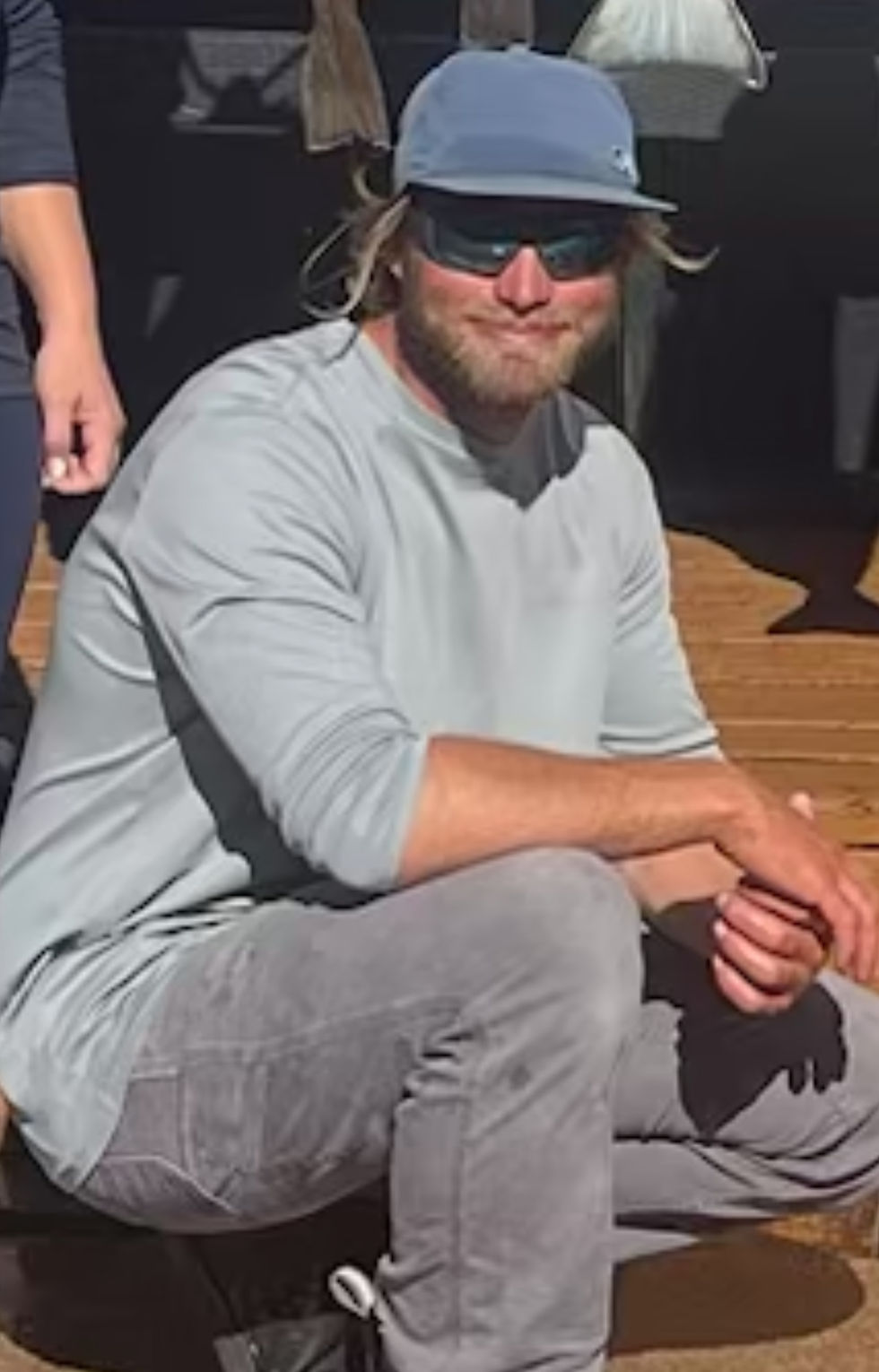 Sportsman's Cove Lodge newest captain, Bridger posing on one of our boats after a day of fishing