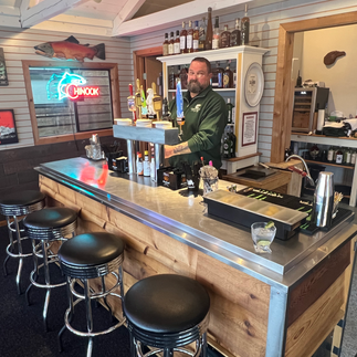An image of the bar at Sportsmans Cove Lodge in Alaska where you can sip and unwind after fishing