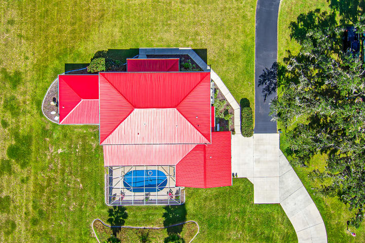 drone photo of a home in dunnellon with a red roof