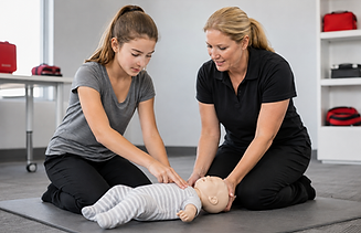 Woman teaching girl infant CPR on a medical mannequin.