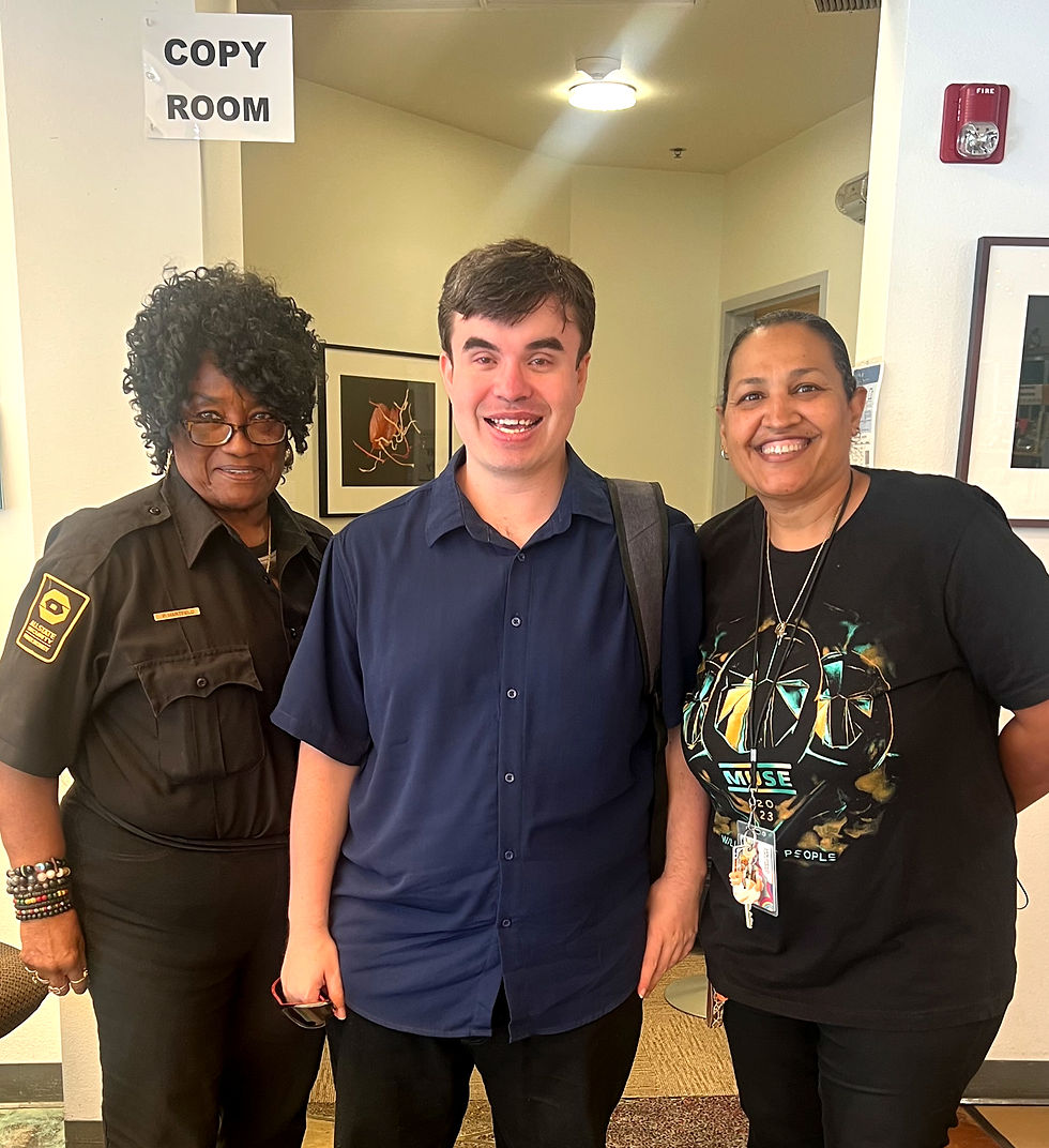 Andrew smiling with Mrs. Pat and Maria