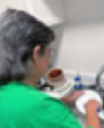 Lynn washing dishes at home