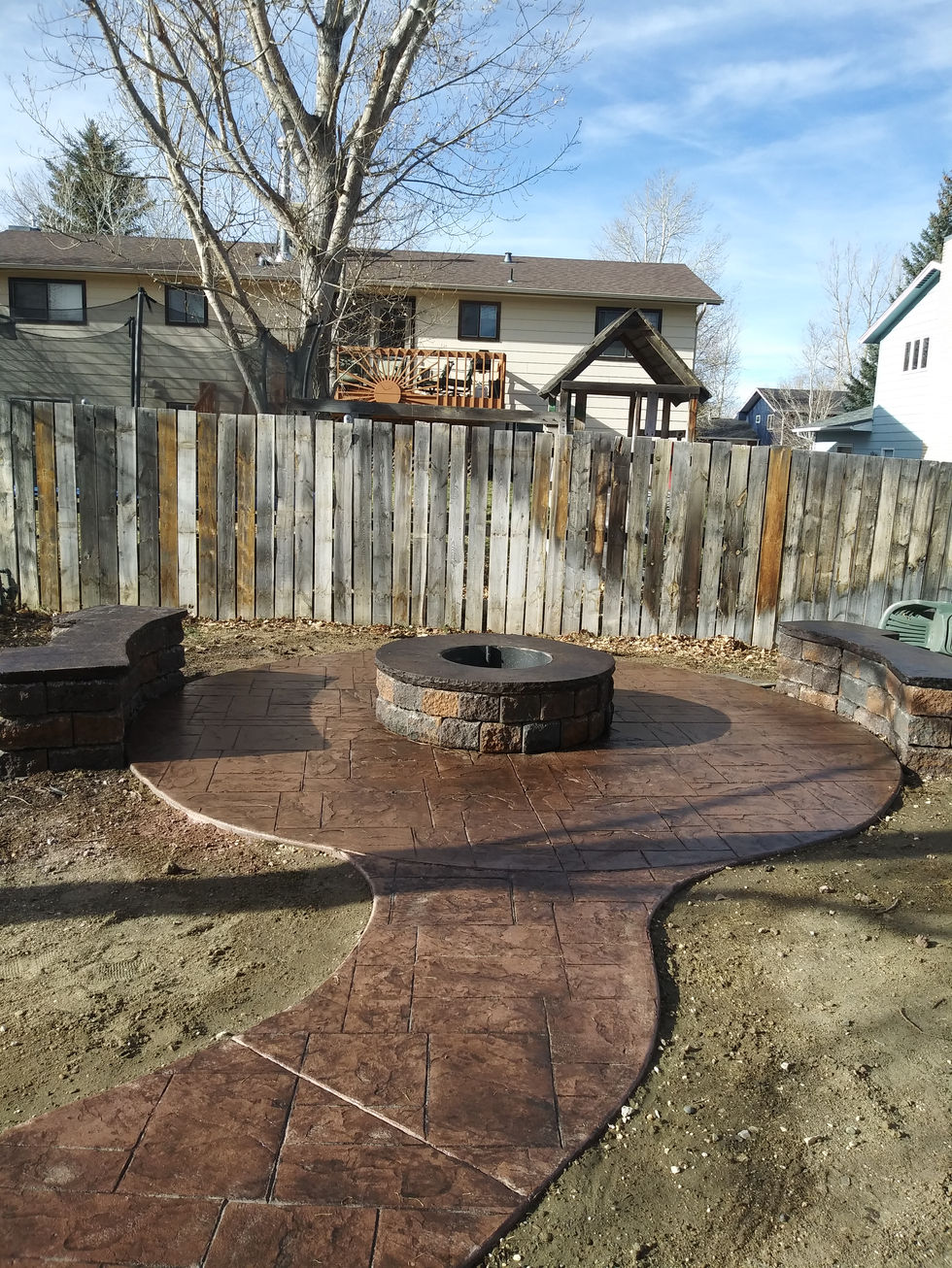 stamped concrete sidewalk and firepit pad