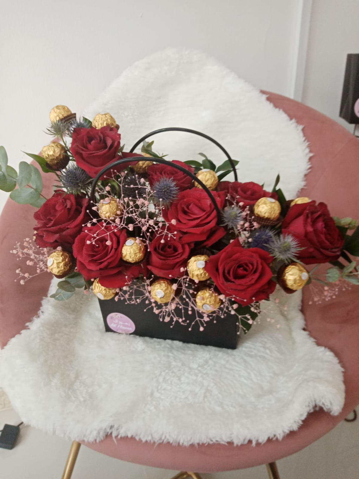 Hand bag fresh flowers with chocolate arrangement