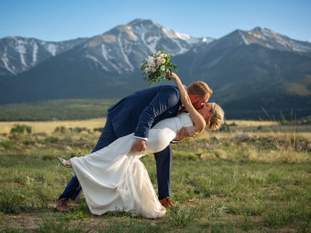 Mountain wedding ceremony in Buena Vista Colorado with Collegiate Peaks backdrop; The Surf Hotel Wedding Videographer