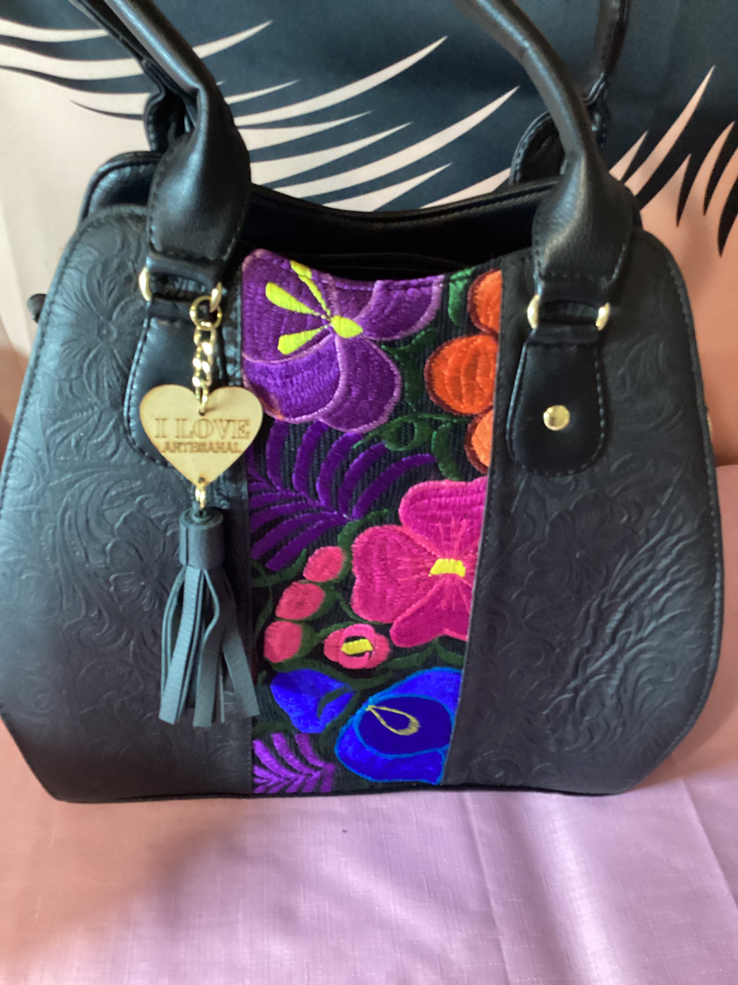 100% leather with embroidery detail