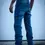 Thumbnail: Angled view of a person in blue jeans and brown shoes, standing on pavement.