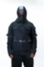 A model wearing the Rogue Shell hoodie with its zip-up face cover, blending urban stealth with bold functionality.
