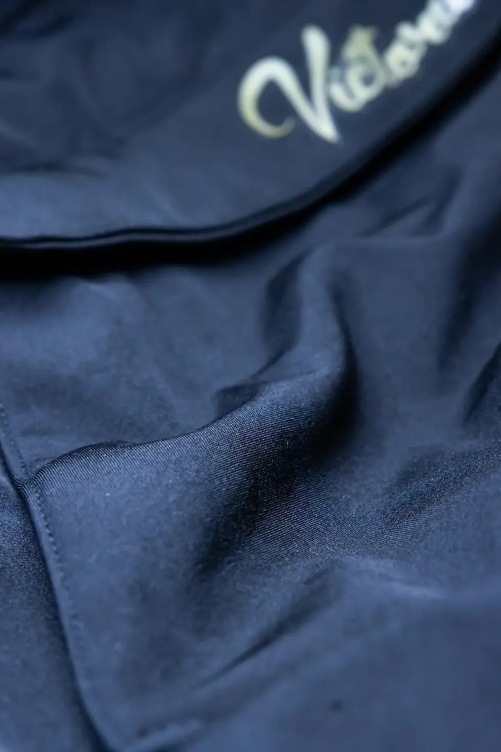 Thumbnail: A detailed close-up of the Rogue Shell hoodie’s premium fabric, showcasing the smooth yet durable