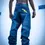 Thumbnail: Back view of a person wearing baggy blue jeans with a yellow patch, standing in a parking lot.