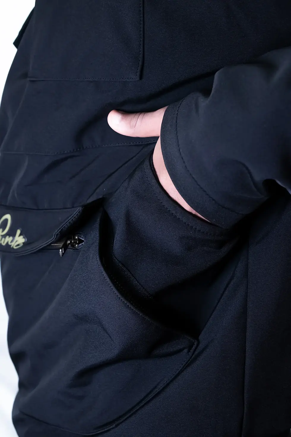 Thumbnail: A deep side pocket detail, showcasing seamless integration for convenience and storage.