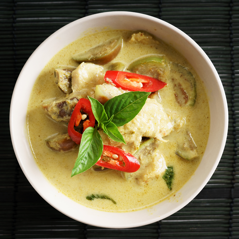 chicken soup with basil as a garnish 