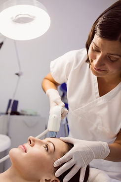 doctor-giving-cosmetic-treatment-female-patient.jpg