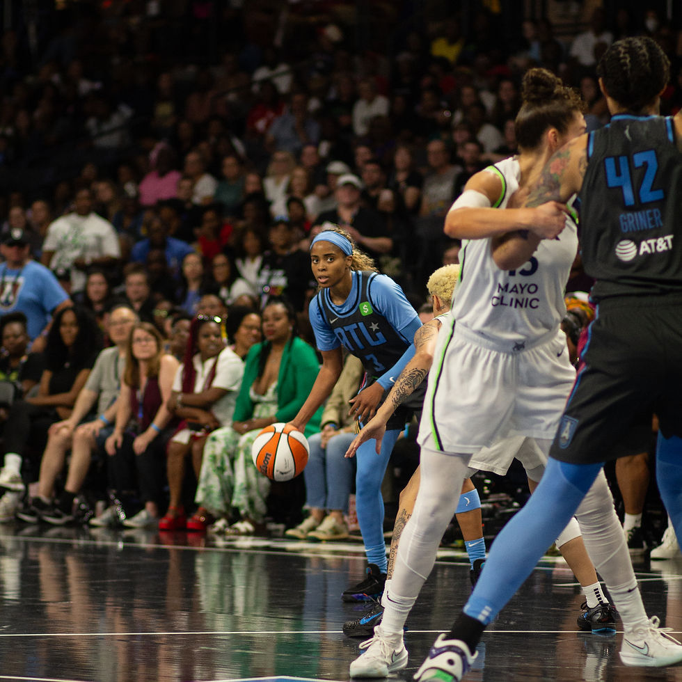 Jordin Canada looks inside to Brittney Griner who is attempting to gain position on Jessica Shepard.