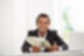 young-successful-businessman-smiling-holding-money-sitting-workplace.jpg
