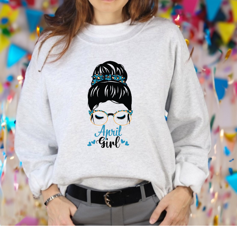 Woman graphic with a messy bun, glasses, and text reading April Girl.
