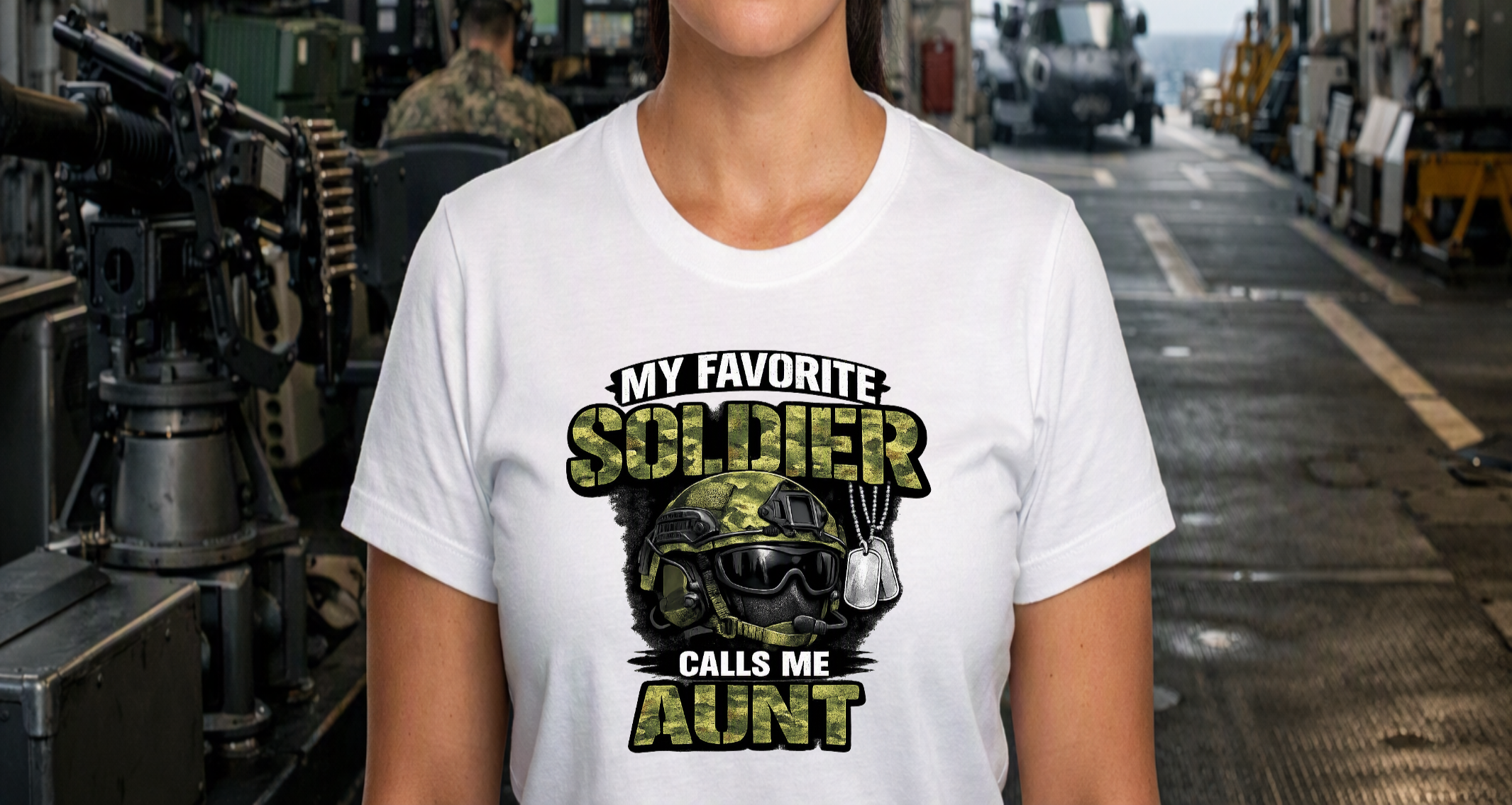 A white military family T-shirt featuring a camouflage soldier helmet, dog tags, and โMy Favorite Soldier Calls Me Auntโ