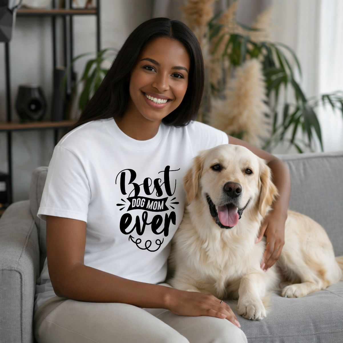 Woman wearing a Best Dog Mom Ever t-shirt while sitting with her dog