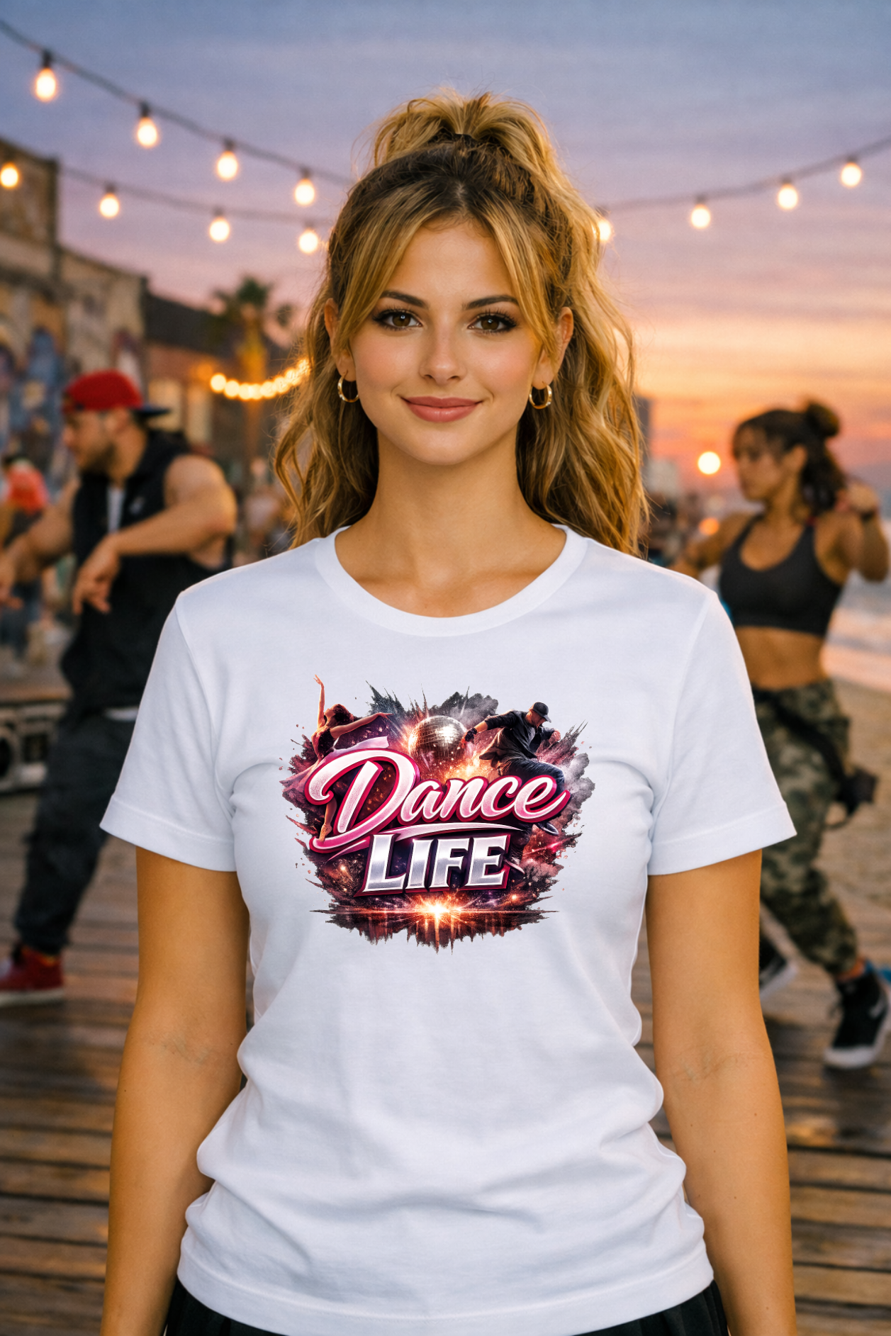 A smiling woman wears a t-shirt featuring dancers moving dynamically around a shining disco ball with the text Dance LIFE.