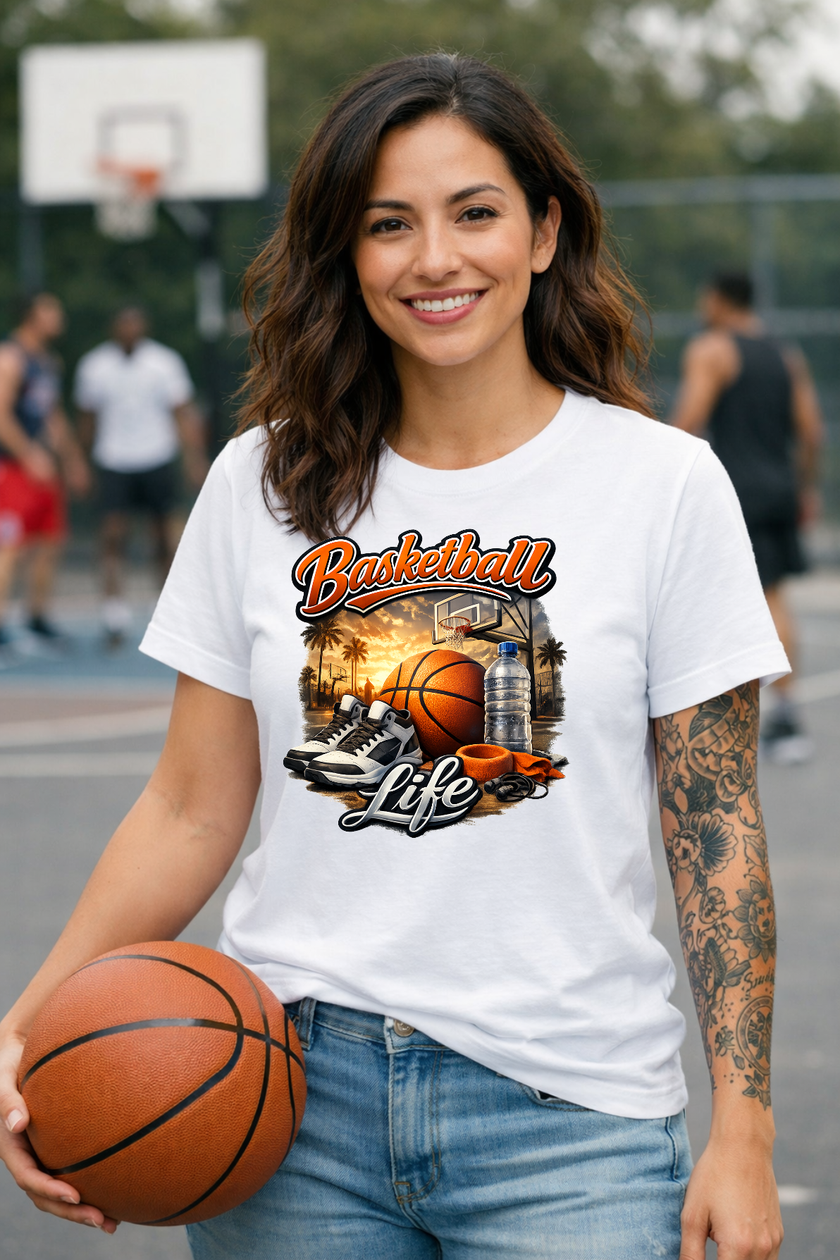 A basketball, sneakers, a water bottle, and a wristband on an outdoor court at sunset below bold Basketball Life text.