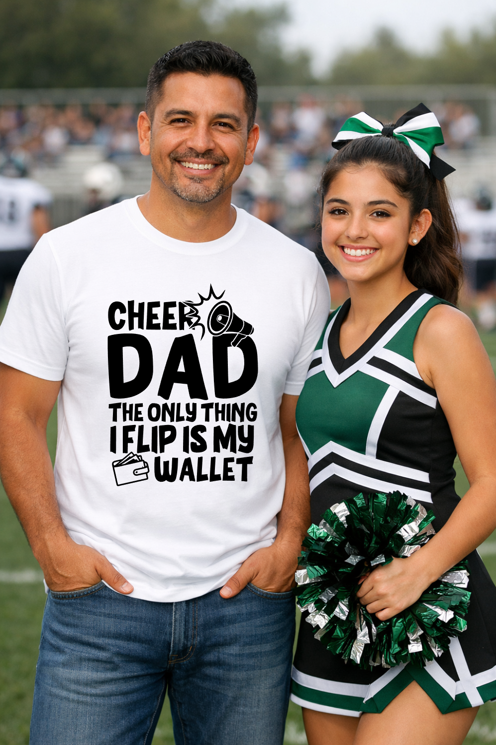 A smiling man standing next to a cheerleader on a field wearing a t-shirt that says Cheer Dad The Only Thing I Flip Is My Wal