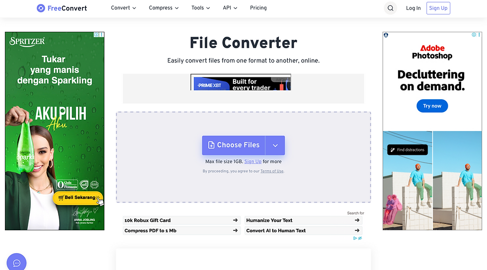FreeConvert file converter website with a "Choose Files" button. Ads for Spritzer drink and Adobe Photoshop visible.