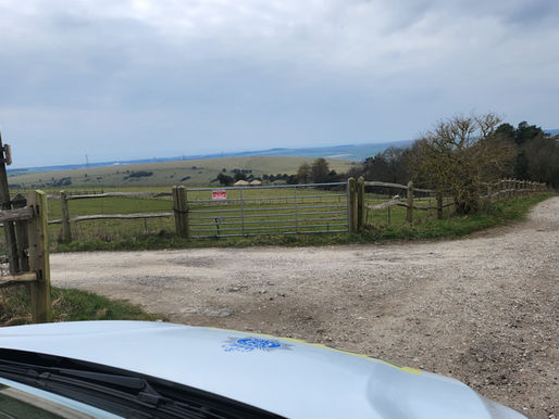 Author's view from a police car facing a vast, empty rural landscape, highlighting why remote estate protection cannot rely solely on emergency response times.