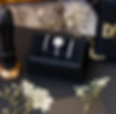 Diamond ring and two bands on a black jewelry case