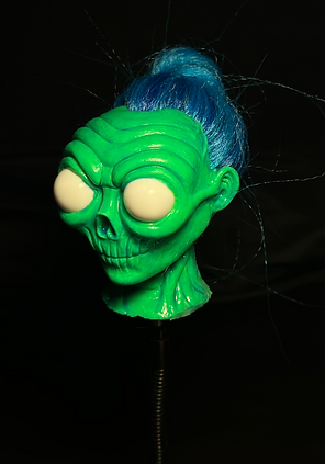 Green Glow in the Dark Silicone Skull Shrunken Head Angle One by David Laff