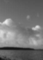 Eerie liminal spaces by a dark lake under cloudy sky