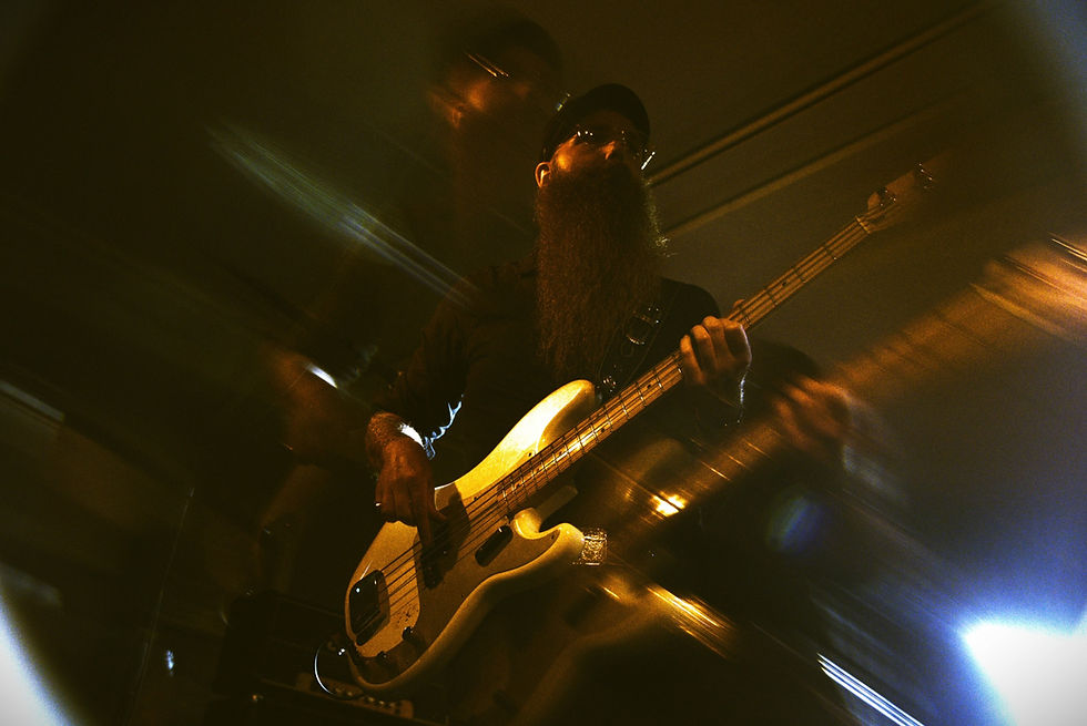 Musician performing at Danhagen Live on bass guitar.