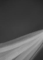 Abstract flowing fabric in monochrome liminal spaces
