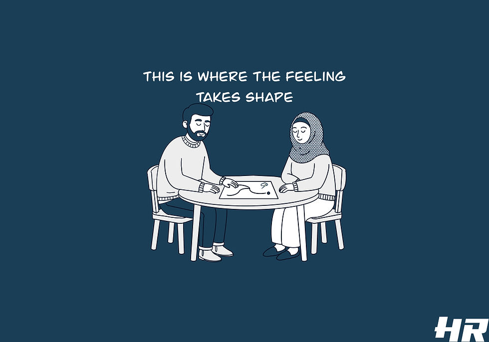 The same two characters are present—continuity matters—but their relationship to the space has subtly shifted.
They are now side by side, not across from one another.