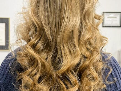 Long layered Buter scotch blond highlights.