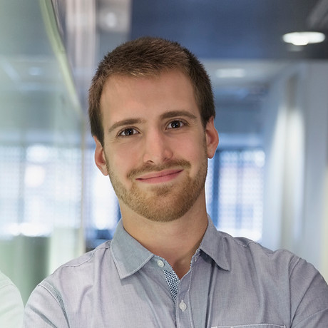 Young Man Smiling in the Office