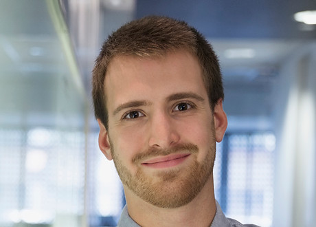 Young Man Smiling in the Office
