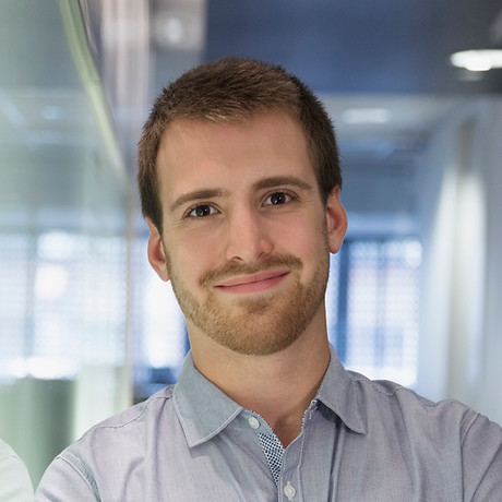 Young Man Smiling in the Office