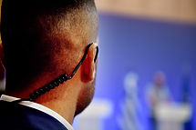 A Security Guard wears an ear headset during a government summit meeting..jpg