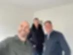 Professional property investor guiding clients through property investment consultation, demonstrating real estate investing for beginners in a residential property investment viewing session