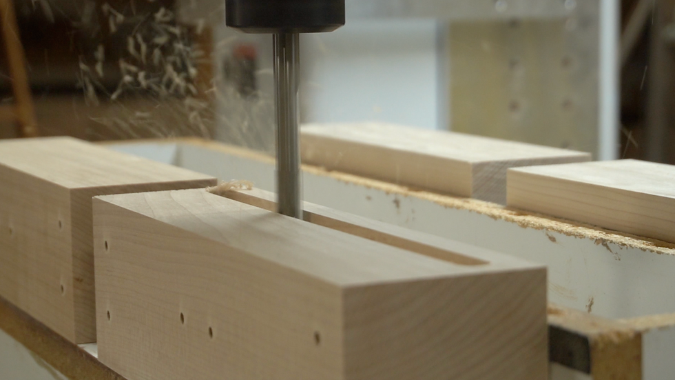 woodblocks on the CNC machine getting sound holes cut