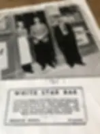 A license, dated 1945 signed by Charles Burns, sits in front of a picture of Charlie and two others.