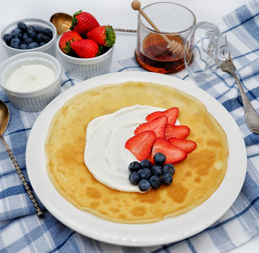 Breakfast crepes with fruit and maple syrup