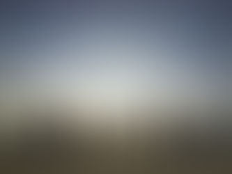 A family on the beach at sunset holding hands