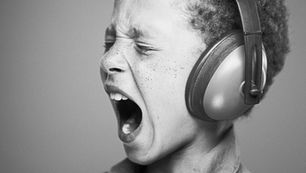 black and white photo of boy screaming