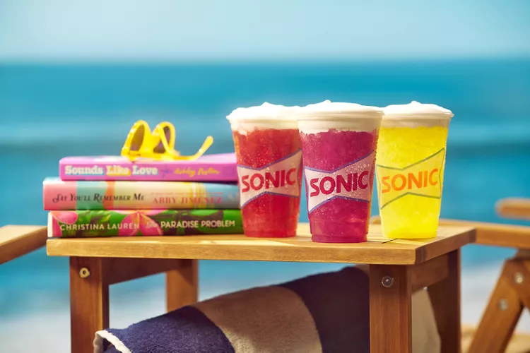 Sonic's latest beverage collaboration not only introduces flavor but also incorporates an unexpected narrative element. Romance authors Christina Lauren, Abby Jimenez, and Ashley Poston are endorsing the new lemonades infused with emotion. Credit: Courtesy of SONIC