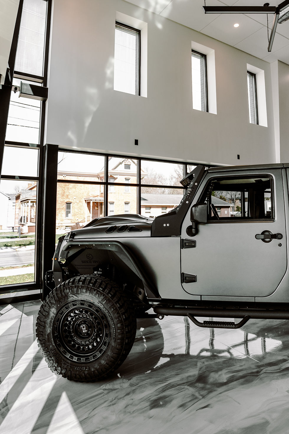Fully Rebuilt Jeep Wrangler Unlimited JK in premier custom paint showroom in zelienople