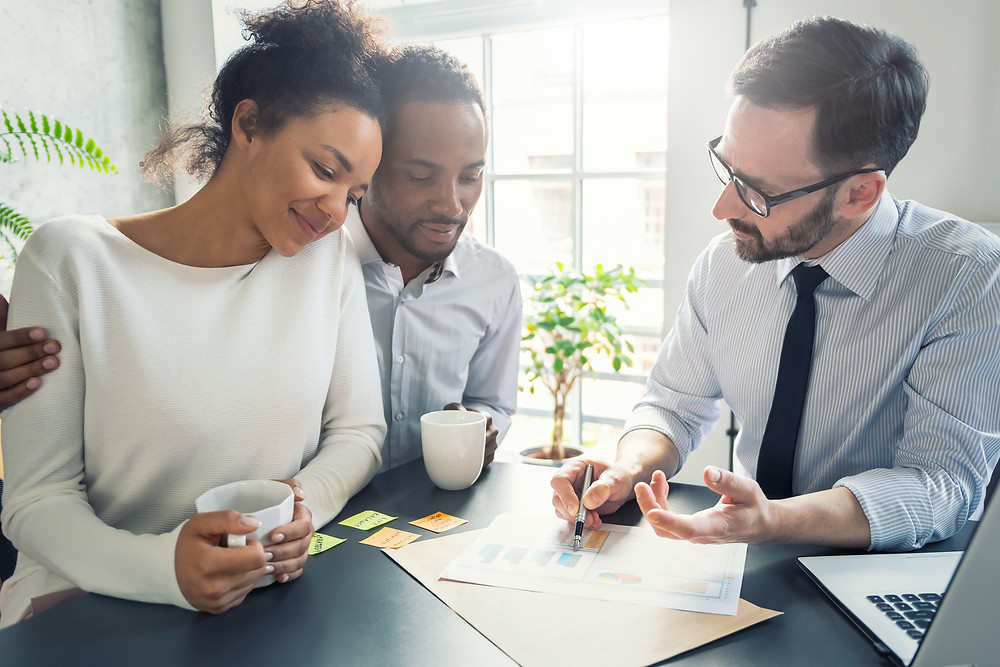 Black couple with a financial adviser