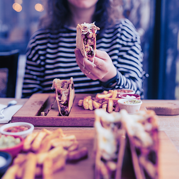 woman eating tacos